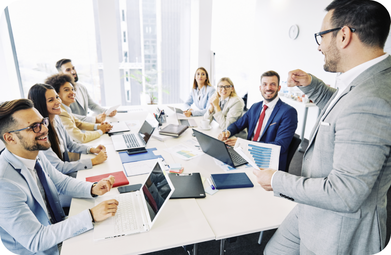 A diverse group of professionals collaborate during a business meeting, showcasing effective teamwork for VET training.